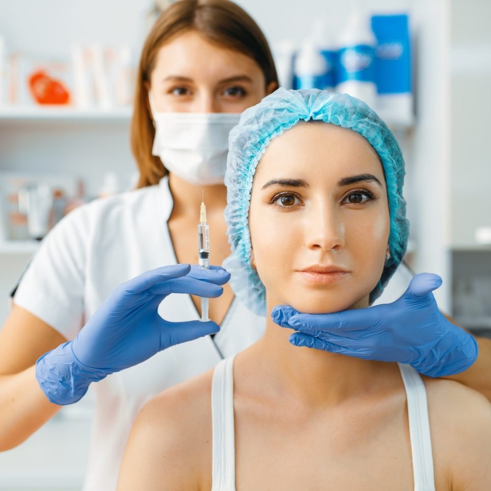 cosmetician-holds-syringe-with-injection-of-botox.jpg